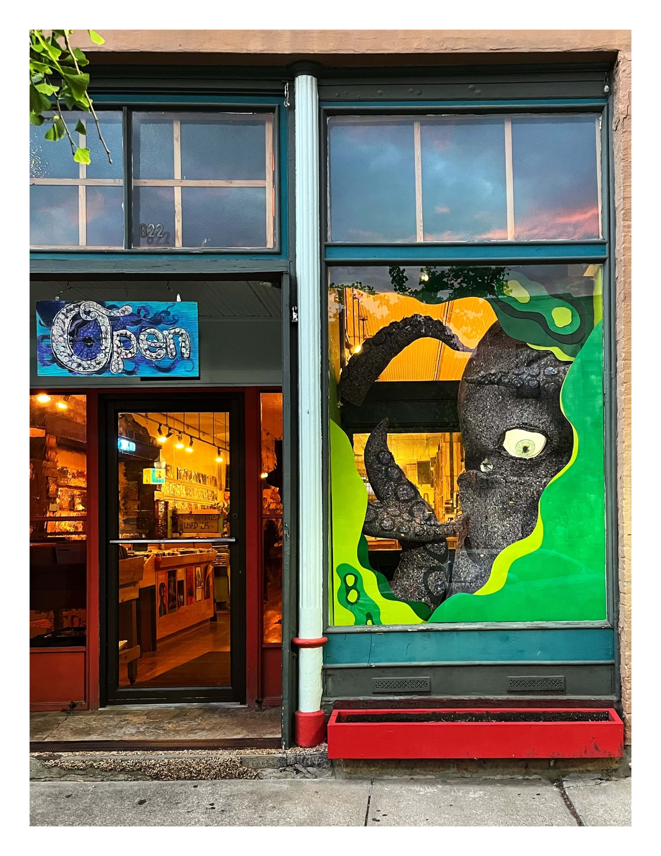 big squid in window at Love Garden record store